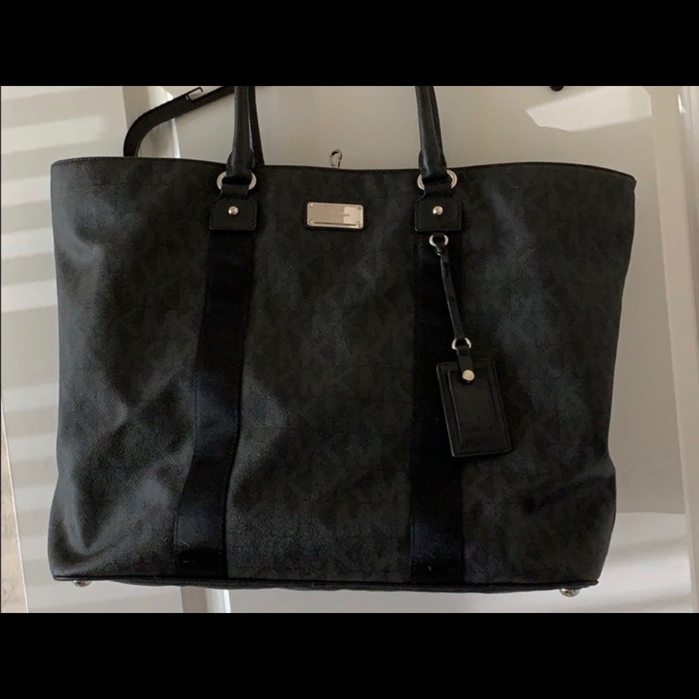 Black leather Michael Kor logo travel/luggage bag